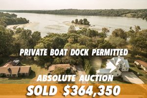 ABSOLUTE AUCTION • SOLD • LAKEFRONT HOME W/ PRIVATE BOAT DOCK PERMIT