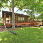 Front view of beautiful log cabin on 5 acres of property