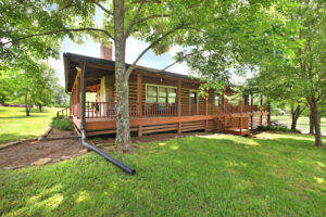 Front view of beautiful log cabin on 5 acres of property