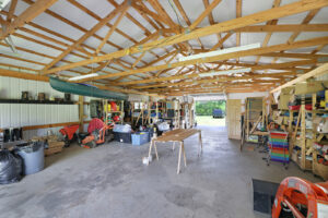 Open ceiling exposing wood ceiling framing