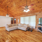 Opening living room with vaulted ceilings at absolute auction by NashvilleAuctions at 140 Captain Bell Lane, Gallatin, TN 37066