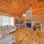 Living room with fireplace at absolute auction by NashvilleAuctions at 140 Captain Bell Lane, Gallatin, TN 37066