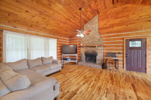 Living room with fireplace at absolute auction by NashvilleAuctions at 140 Captain Bell Lane, Gallatin, TN 37066