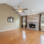 living room with fire place and vaulted ceilings