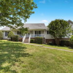front of home for absolute auction with NashvilleAuctions