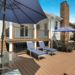 deck attached to pool for lounging
