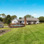 Rear view of home with pool