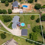 Aerial view of home with pool