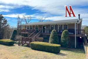 Front view of a spacious two-story home on 1.39± acres in Madison, TN, featuring a well-maintained lawn and a two-car garage.